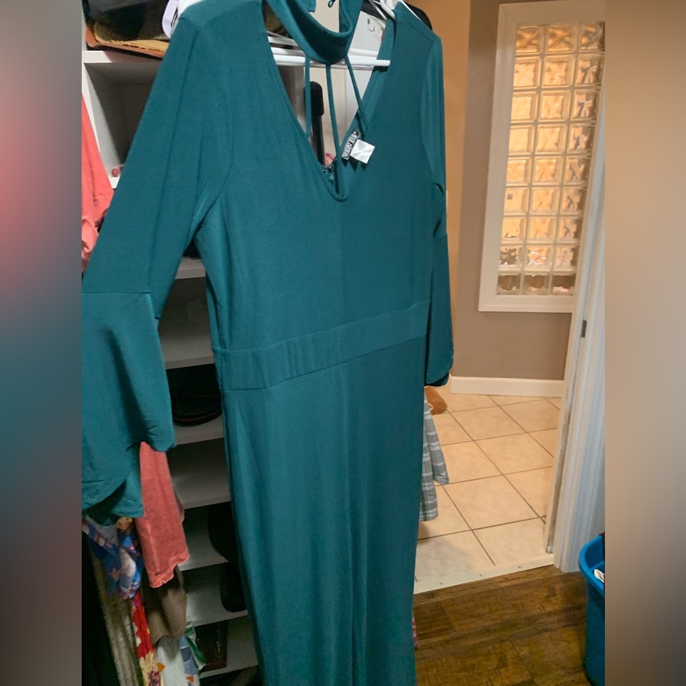 NWOT PULL ON JUMPSUIT DETAILED NECK venus brand. Wide leg. Bell sleeves.